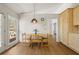 Eat-in kitchen features wood floors, natural light, and breakfast area at 877 Old Farm Walk, Marietta, GA 30066