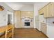 Bright kitchen features wood floors, ample cabinet space, and modern appliances at 877 Old Farm Walk, Marietta, GA 30066