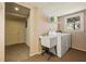 Bright laundry room with washer, dryer, and utility sink at 877 Old Farm Walk, Marietta, GA 30066