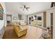 Inviting living room showcasing a large window with a view, complemented by hardwood flooring at 877 Old Farm Walk, Marietta, GA 30066