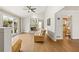 Spacious living room with hardwood floors, a brick fireplace, and large windows at 877 Old Farm Walk, Marietta, GA 30066