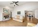 Bright living room featuring vaulted ceilings, fireplace, and seamless flow to the dining area at 877 Old Farm Walk, Marietta, GA 30066