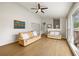 Open-concept living room with abundant natural light and hardwood floors, perfect for entertaining at 877 Old Farm Walk, Marietta, GA 30066