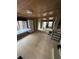 Inviting living room with tile floors, wood ceiling, and ample natural light from large windows at 1000 Delta A15, Canton, GA 30114
