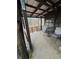 Relaxing covered porch featuring chairs and a table, ideal for enjoying the surrounding nature at 1000 Delta A15, Canton, GA 30114