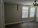 Comfortable bedroom featuring natural light from the many large windows at 2468 Baxter Sw Rd, Atlanta, GA 30315