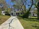 Charming single-story home with a well-maintained lawn and a long driveway at 2468 Baxter Sw Rd, Atlanta, GA 30315
