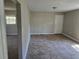 Inviting living area featuring tile flooring, neutral walls, and a view into another room at 251 Banberry Se Dr, Atlanta, GA 30315