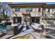 Outdoor patio with comfortable seating, ceiling fan, and TV for relaxation and entertainment at 5780 Riverwood Dr, Sandy Springs, GA 30328
