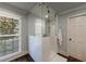 Bright walk-in shower featuring white subway tiles and glass enclosure at 5780 Riverwood Dr, Sandy Springs, GA 30328