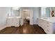 Bright primary bathroom featuring double vanity, sleek cabinets, and natural light at 5780 Riverwood Dr, Sandy Springs, GA 30328