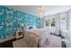 Charming bedroom with designer wallpaper, plush bedding, and ample natural light at 5780 Riverwood Dr, Sandy Springs, GA 30328