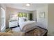 Cozy bedroom with a colorful area rug, white furniture, and plenty of natural light at 5780 Riverwood Dr, Sandy Springs, GA 30328