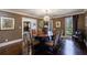 Bright dining area showcasing hardwood floors, contemporary lighting, and sophisticated accents at 5780 Riverwood Dr, Sandy Springs, GA 30328