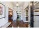 Elegant foyer with hardwood floors and decorative lighting offering access to other rooms at 5780 Riverwood Dr, Sandy Springs, GA 30328