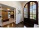 Beautiful entryway with a glass-paneled door, dark wood floors, and access to a private office at 5780 Riverwood Dr, Sandy Springs, GA 30328