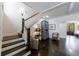 Bright foyer features staircase, hardwood floors, and classic design elements at 5780 Riverwood Dr, Sandy Springs, GA 30328