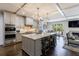 Modern kitchen features a large island, stainless steel appliances, and seamless access to the living area at 5780 Riverwood Dr, Sandy Springs, GA 30328