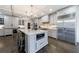 Gourmet kitchen with custom cabinetry, stainless steel appliances, and a large island with counter seating at 5780 Riverwood Dr, Sandy Springs, GA 30328