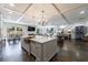 Open concept kitchen features marble counters, an island, and dark hardwood floors at 5780 Riverwood Dr, Sandy Springs, GA 30328