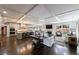 Open-concept living room featuring hardwood floors, coffered ceiling, and seamless flow to the gourmet kitchen at 5780 Riverwood Dr, Sandy Springs, GA 30328
