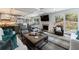 Bright living room featuring stylish decor, a cozy fireplace, and sliding doors leading to the outdoor space at 5780 Riverwood Dr, Sandy Springs, GA 30328