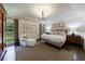 Bright primary bedroom featuring hardwood floors, natural light, and neutral tones at 5780 Riverwood Dr, Sandy Springs, GA 30328