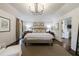 Bright primary bedroom featuring hardwood floors, natural light, and neutral tones at 5780 Riverwood Dr, Sandy Springs, GA 30328