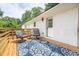 Outdoor wooden deck featuring an outdoor rug, outdoor seating, and a serene backyard view at 661 Inglewood Se Dr, Smyrna, GA 30080