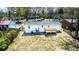 Aerial view of a home's backyard with a small deck and a newly painted white exterior at 661 Inglewood Se Dr, Smyrna, GA 30080