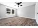 Bright bedroom features wood-look floors and a ceiling fan at 661 Inglewood Se Dr, Smyrna, GA 30080