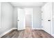 An empty bedroom shows the closet with wire shelving; fresh gray paint, white trim, and wood-look flooring at 661 Inglewood Se Dr, Smyrna, GA 30080
