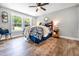 Cozy bedroom with natural light, hardwood floors, and modern decor at 661 Inglewood Se Dr, Smyrna, GA 30080