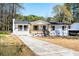 Well-maintained single-story home features a front porch, updated windows, and charming curb appeal at 661 Inglewood Se Dr, Smyrna, GA 30080