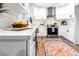 Modern kitchen with white cabinets, stainless steel appliances, granite countertops, and stylish decor at 661 Inglewood Se Dr, Smyrna, GA 30080