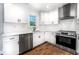Modern kitchen with stainless steel appliances, white cabinets, and stylish countertops at 661 Inglewood Se Dr, Smyrna, GA 30080