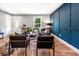 Inviting living room featuring stylish decor, a bold accent wall, and an open layout at 661 Inglewood Se Dr, Smyrna, GA 30080