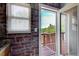 Cozy balcony access from brick-walled room with view of trees at 561 Formwalt Sw St # 6, Atlanta, GA 30312