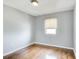 Cozy bedroom with light-filled window and hardwood floors providing a serene retreat at 561 Formwalt Sw St # 6, Atlanta, GA 30312
