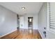 Hardwood floored living room with neutral paint and access to the kitchen at 561 Formwalt Sw St # 6, Atlanta, GA 30312