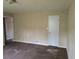This carpeted bedroom features two doorways and neutral walls at 7508 Asbury Manor Dr, Lithonia, GA 30058