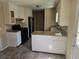Efficient kitchen with granite countertops, stainless steel appliances, and ample cabinet space at 7508 Asbury Manor Dr, Lithonia, GA 30058