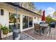 Outdoor dining on the back deck, featuring a patio heater, table with umbrella and stylish outdoor lighting at 994 Redbud Sw Ln, Atlanta, GA 30311