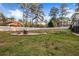 Expansive backyard featuring an outdoor living area and mature trees at 994 Redbud Sw Ln, Atlanta, GA 30311
