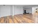 Spacious basement featuring wood-look flooring and neutral walls, perfect for flexible living or recreation at 994 Redbud Sw Ln, Atlanta, GA 30311