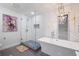 Modern bathroom features a freestanding tub, a glass-enclosed shower, and unique decor at 994 Redbud Sw Ln, Atlanta, GA 30311