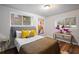 Bright bedroom with a comfortable bed, natural light, and stylish decor at 994 Redbud Sw Ln, Atlanta, GA 30311