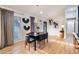 Bright dining room featuring a modern chandelier, stylish artwork, and plenty of natural light at 994 Redbud Sw Ln, Atlanta, GA 30311