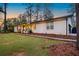 Spacious home with a lush green lawn and updated exterior features at 994 Redbud Sw Ln, Atlanta, GA 30311