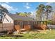 This backyard features a fenced yard, two decks, a pergola, and above ground pool at 1354 Litchfield Ct, Snellville, GA 30078